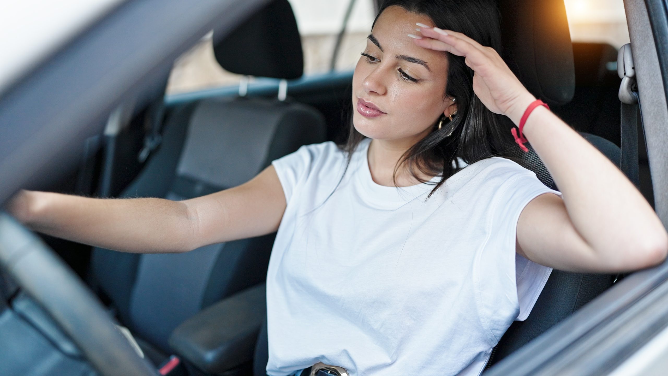 Young,Beautiful,Hispanic,Woman,Driving,Car,At,Street